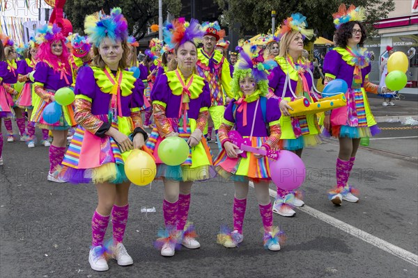Three girls in elaborate costumes