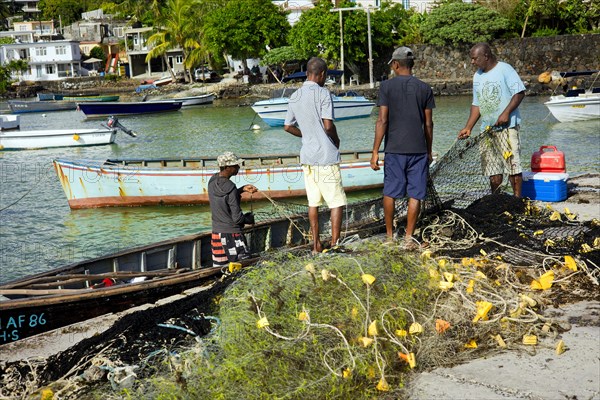 Fishermen on the quay wall