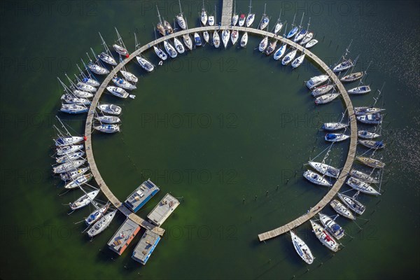 Aerial view over sailing boats docked in the Burgtiefe marina at on Fehmarn