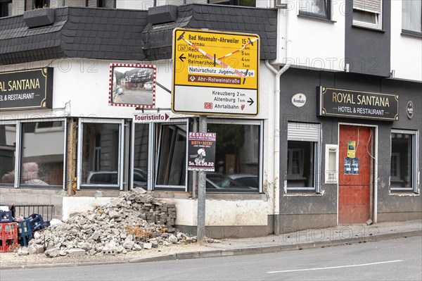 A street sign stands by a damaged house in Altenahr