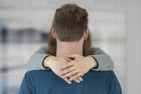 Young couple with engagement ring.