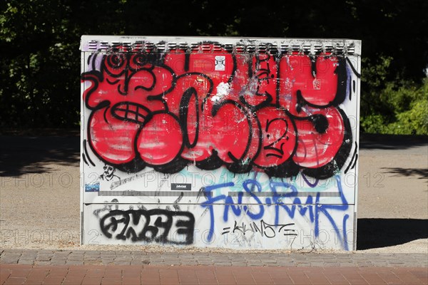 Graffitied colourful electricity distribution board