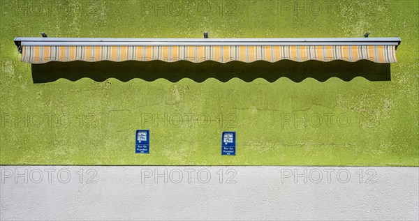 Awning on a bare house wall