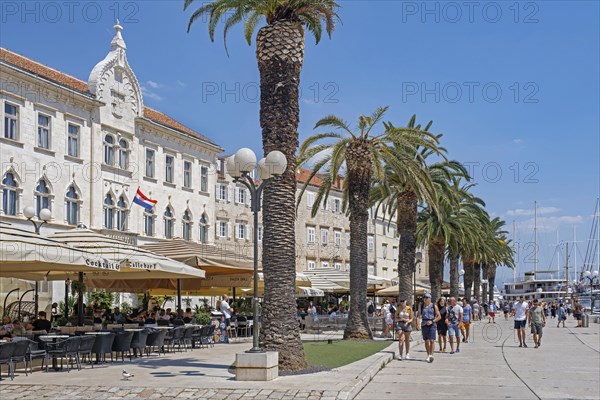 Restaurants and cafes along promenade at harbour of the historic Old Town of Trogir along the Adriatic Sea