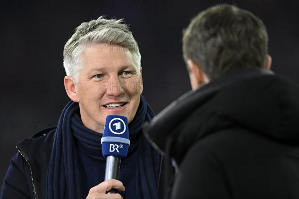 TV expert Bastian Schweinsteiger interviewed by ARD presenter Alexander Bommes