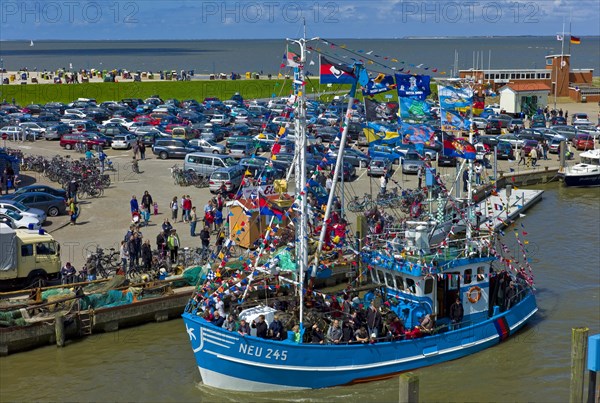 Decorated crab cutter in the harbour of Neuharlingersiel