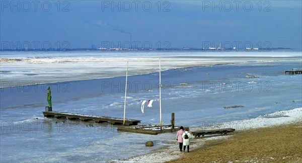 View over the frozen Jade Bay towards Wilhelmshaven