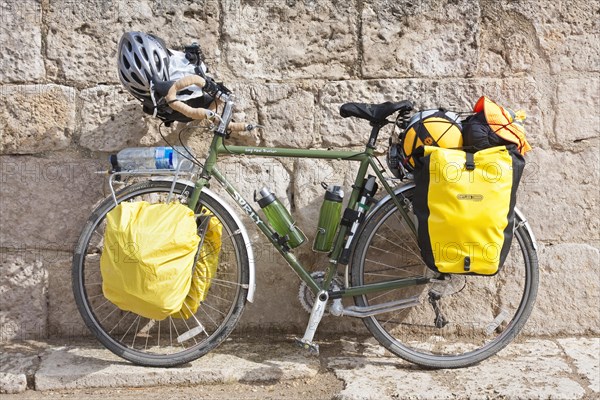 Pilgrims bicycle parked in front of a church