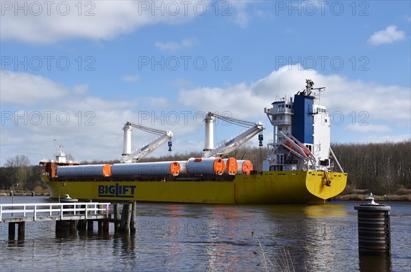 Cargo ship with wind turbine in Kiel Canal