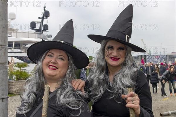 Portrait of two smiling witches at the carnival in the city of Rijeka