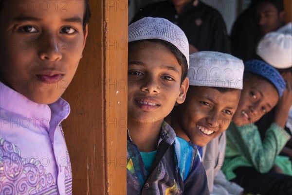 Indian Muslim children arrives to perform the second Friday prayer in the holy month of Ramadan at a Mosque in Guwahati