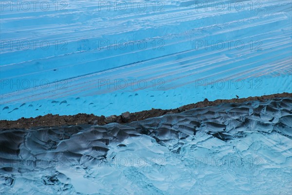 Blue ice abstract close-up of the Negribreen glacier at Spitsbergen