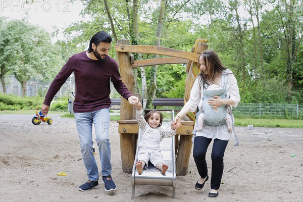 Family with children on a playground