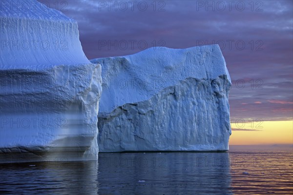 Icebergs at sunset in the Kangia icefjord