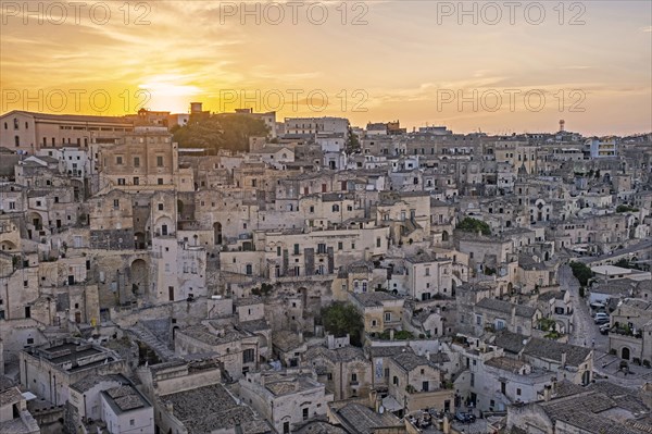 View over the Sassi di Matera complex of cave dwellings at sunset in the ancient town of Matera