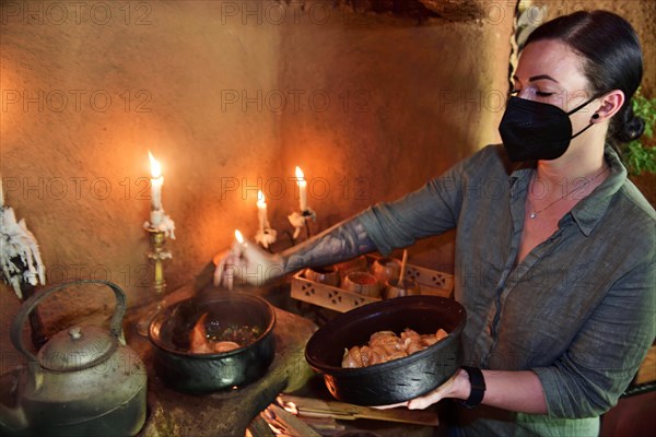 Tourist at a cooking class for typical Sri Lankan kitchen