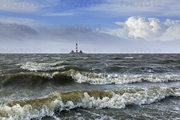 Lighthouse Westerheversand at Westerhever during high water spring tide