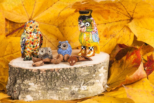 Owl figures on a wooden block