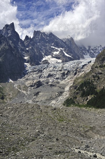 Retreating glacier in July 2009 in the Mount Blanc massif seen from the Val Veny valley showing moraine and polished bedrock
