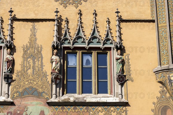 Ulm Town Hall with ornate windows with elector figures and facade with murals