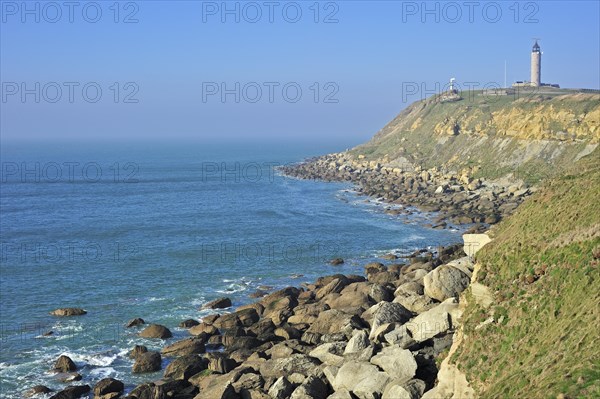 Lighthouse and sandstone boulders from cliff on beach at Cap Gris Nez