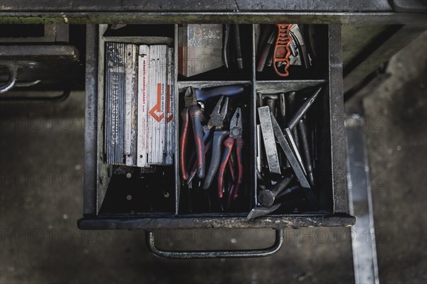 Tool lying in a drawer