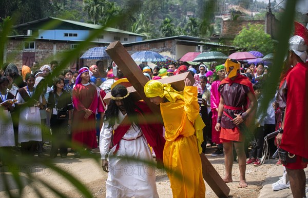 Christian devotees during the annual Good Friday procession to re-enact the crucifixion of Jesus Christ on April 7