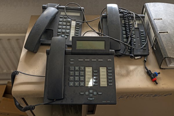 Phones left behind in an office of a former paper factory