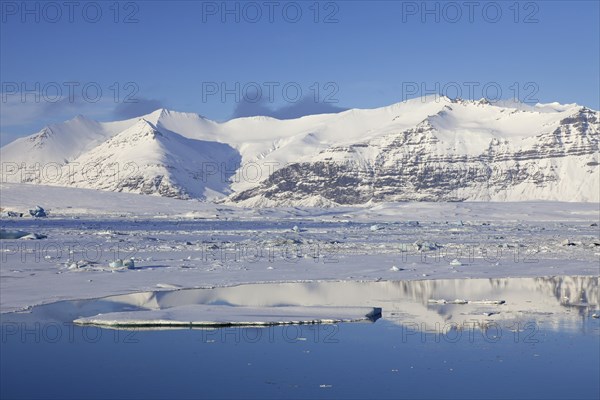 Drift ice floating in Joekulsarlon glacier lagoon in winter