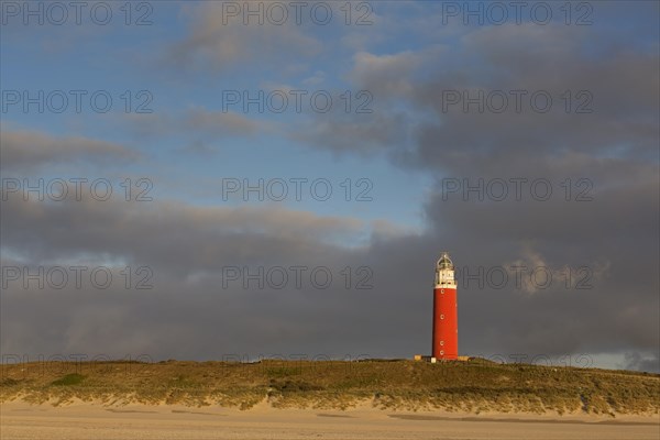 Eierland Lighthouse in the dunes during stormy weather on the northernmost tip of the Dutch island of Texel