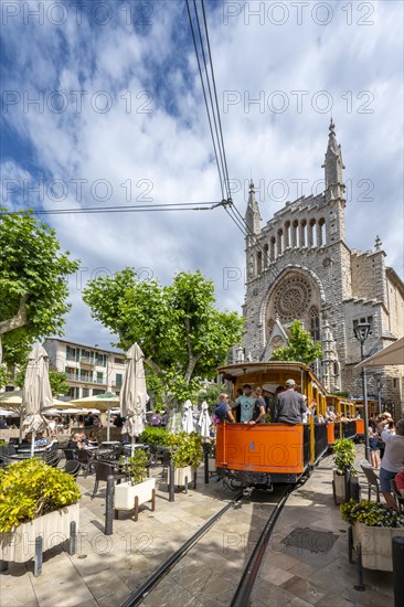 Historical tramway Tren de Soller and church Parroquia de Sant Bartomeu de Soller