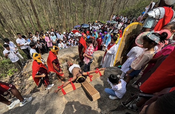 Christian devotees during the annual Good Friday procession to re-enact the crucifixion of Jesus Christ on April 7