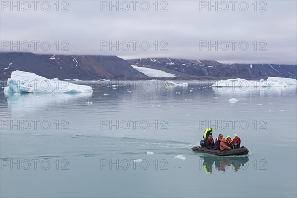 Zodiac boat with eco-tourists visiting Monacobreen