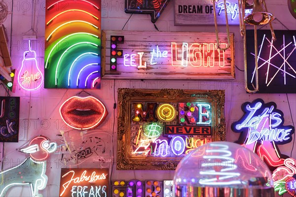 Room full of bright colourful neon signs