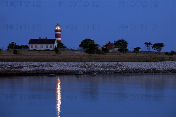 The red and white lighthouse Naers fyr at Naersholmen on the island Gotland