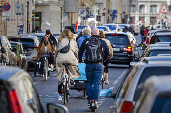 Symbolic photo on the subject of bicycle lanes in the city. Cyclists ride on the bicycle street in Linienstrasse in Berlin Mitte. Berlin