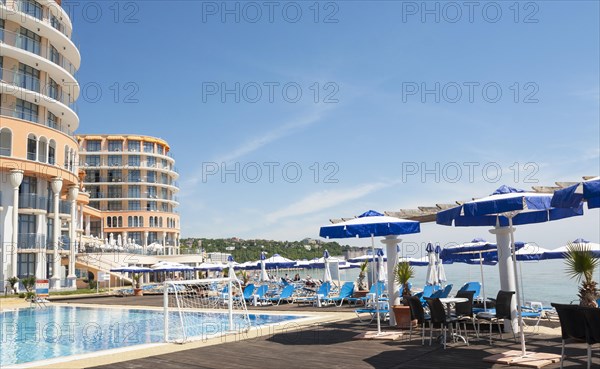 Azalia hotel with swimming pool and umbrellas on the beach