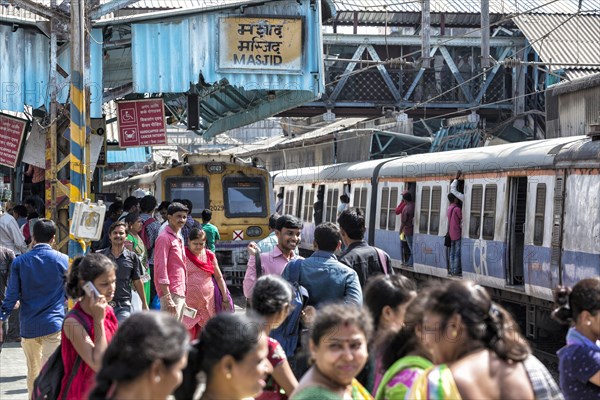 Crowded trains and passengers at MASJID STATION of the Central Line