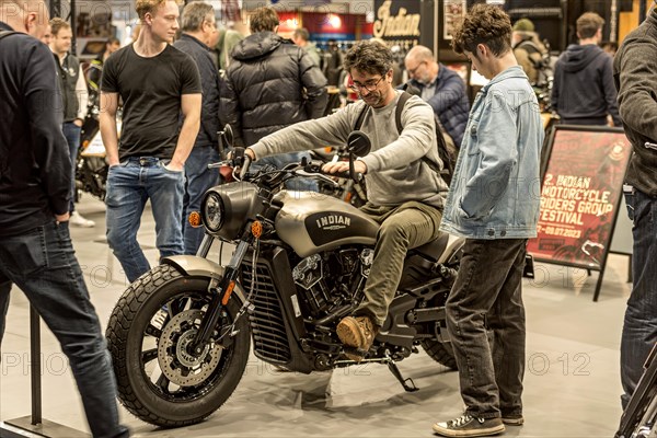 Man sits test on motorbike Indian Scout Bobber