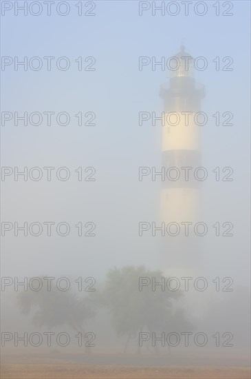 The lighthouse phare de Chassiron in the mist at Saint-Denis-dOleron on the island Ile dOleron