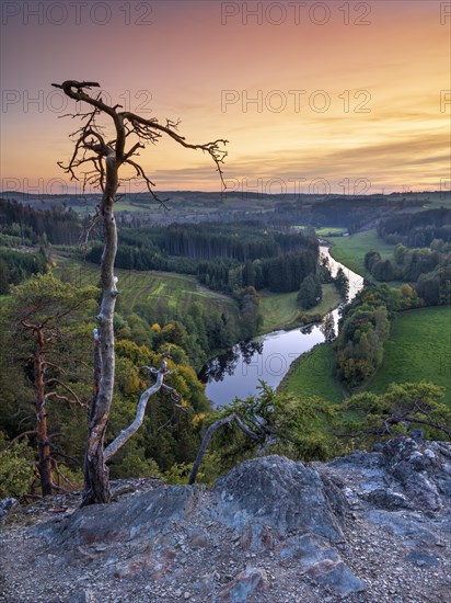 View from Petersgrat in the Franconian Forest of the river Saale at sunset