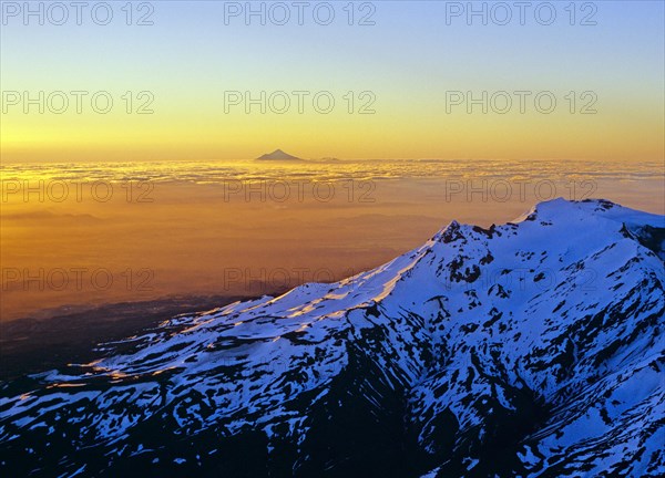 Aerial view of Mount Ruapehu with Mount Taranaki seen in the far distance North Island New Zealand