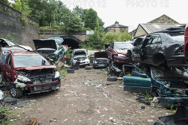 Crushed cars in scrap yard UK