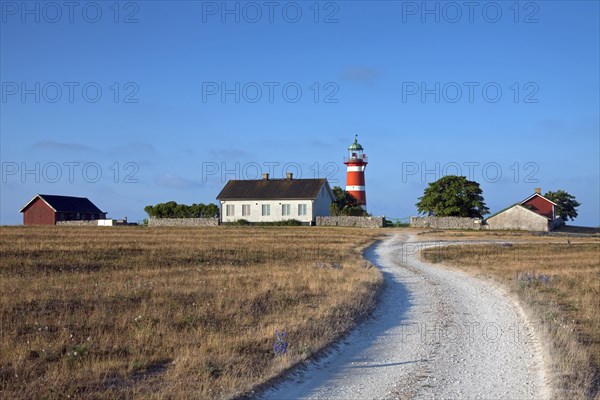 The red and white lighthouse Naers fyr at Naersholmen on the island Gotland