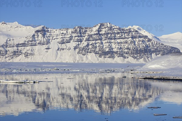 Snow covered mountains along the Joekulsarlon glacier lagoon in winter