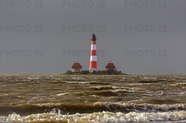 Lighthouse Westerheversand at Westerhever during high water spring tide