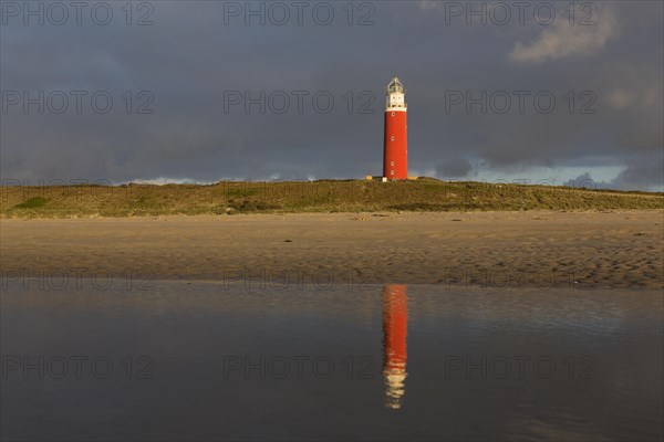 Eierland Lighthouse in the dunes during stormy weather on the northernmost tip of the Dutch island of Texel