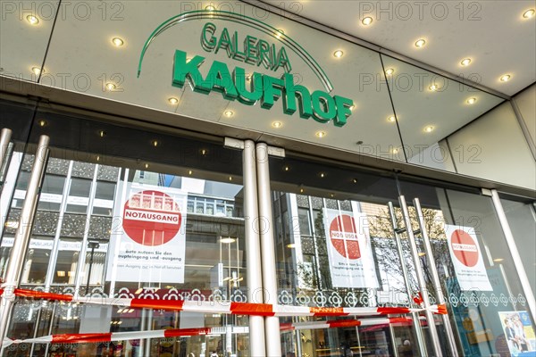 Closed entrance doors of a Galeria Kaufhof shop that is about to close