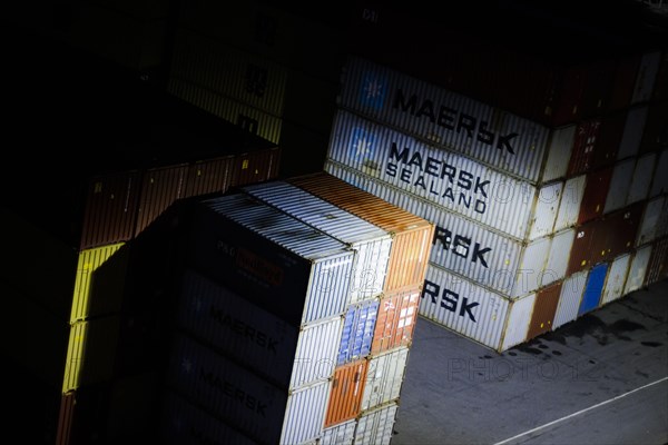 Overseas containers from MAERSK SEALAND stand in the harbour of Kristiansand at night. Kristiansand