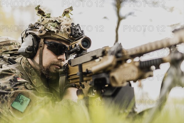 A Bundeswehr soldier with rifle at the ready